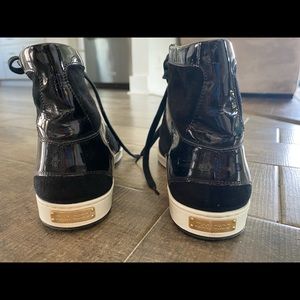 Jimmy Choo black patent leather and suede high top sneakers.